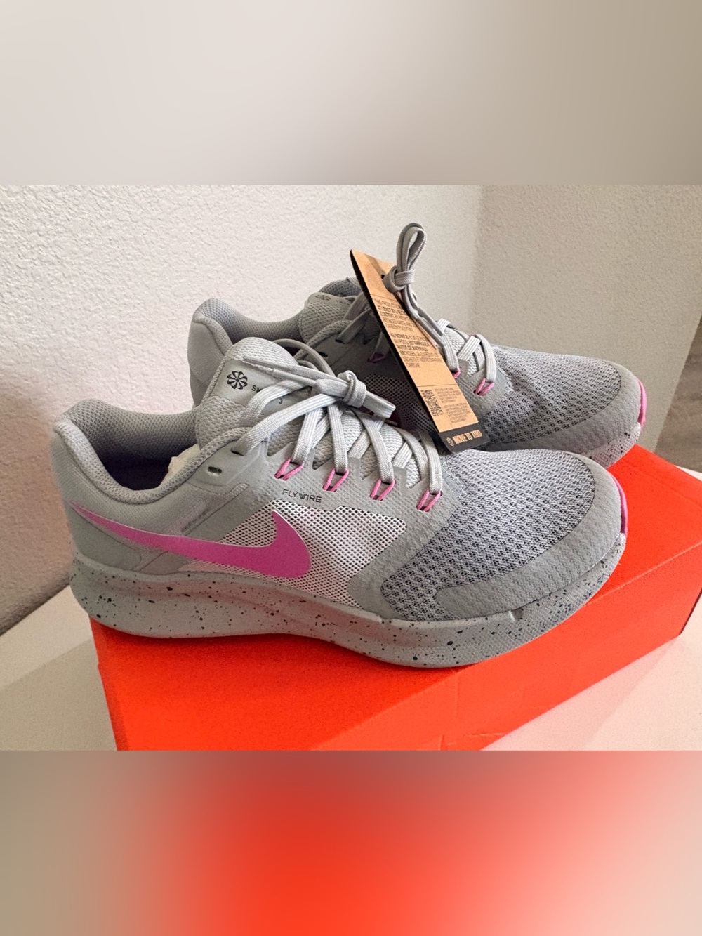 Nike Women's Gray Athletic Trainers with Pink Swoosh